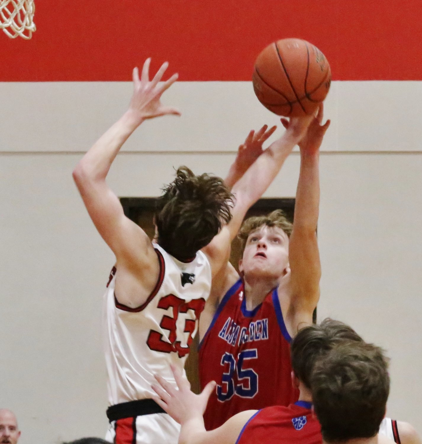 Alba-Golden’s Gavin Parker goes up for an offensive rebound in action against North Hopkins.